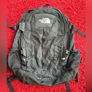 The North Face Black Backpack small hole
In front pocket